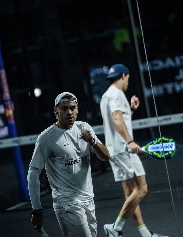 Padel players embracing on court
